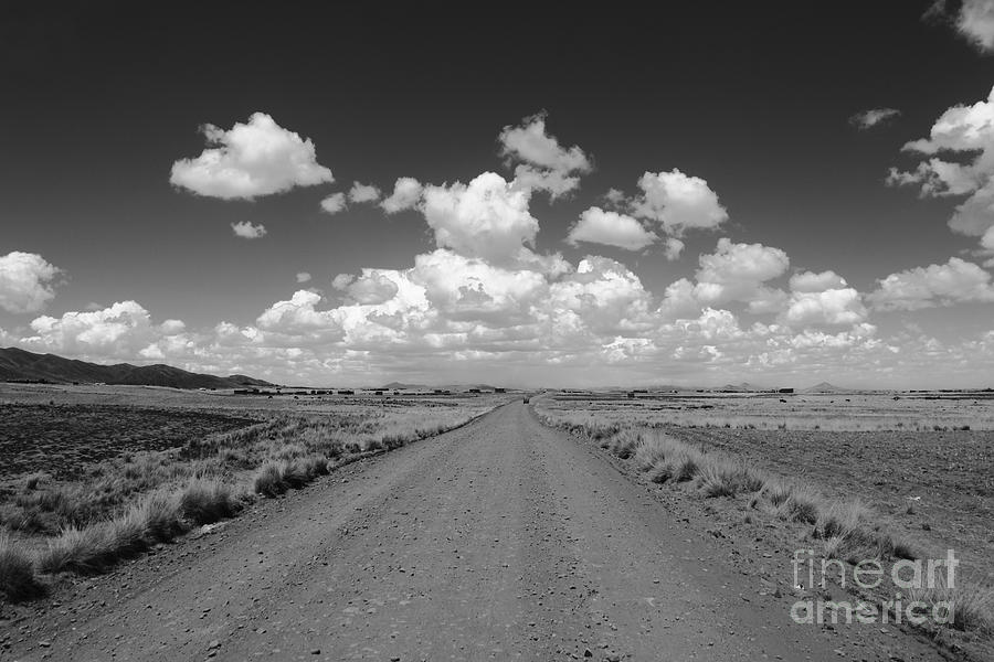 Black And White Photograph - Lonely Road Across the Altiplano by James Brunker