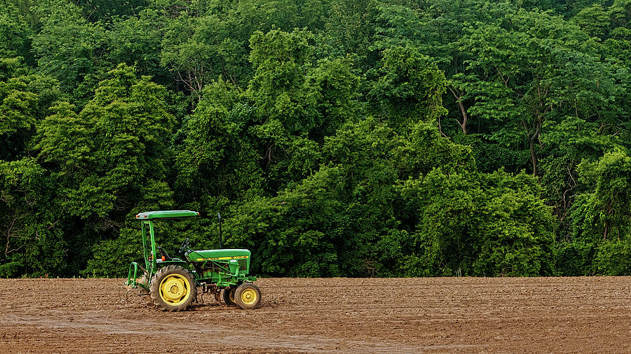 Lonely Tractor In Open Field Photograph by Gary Slawsky