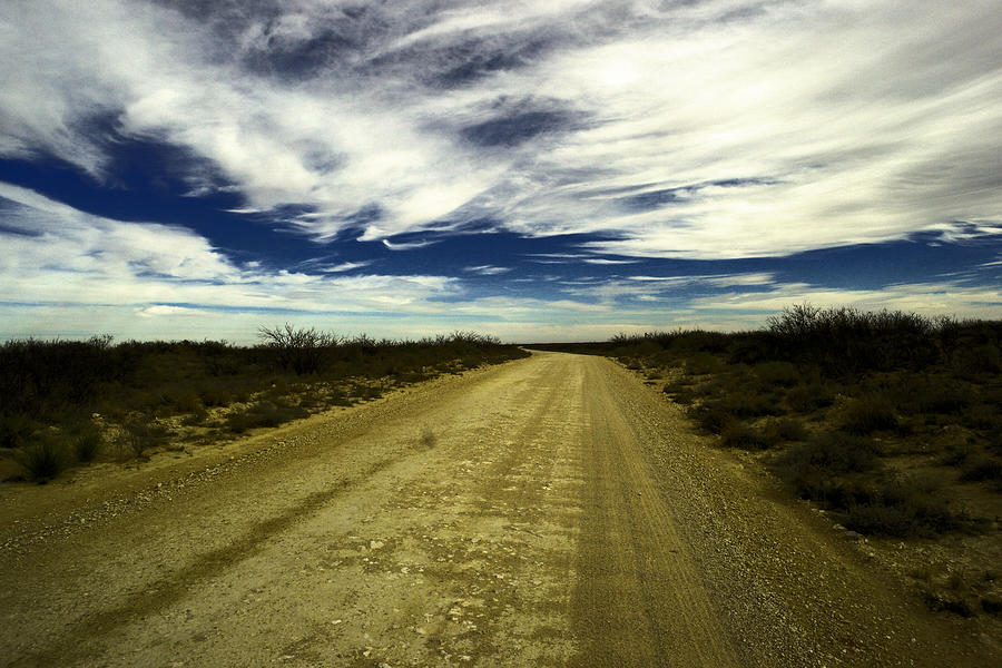 Long Dusty road in Jal New Mexico  Photograph by Jeff Swan