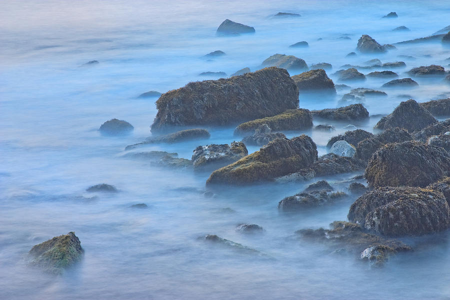Long Exposure of Rocks and Waves at Sunset. Photograph by Keith Webber Jr