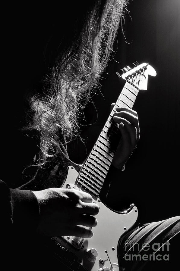 Long Hair Man Playing Guitar Photograph