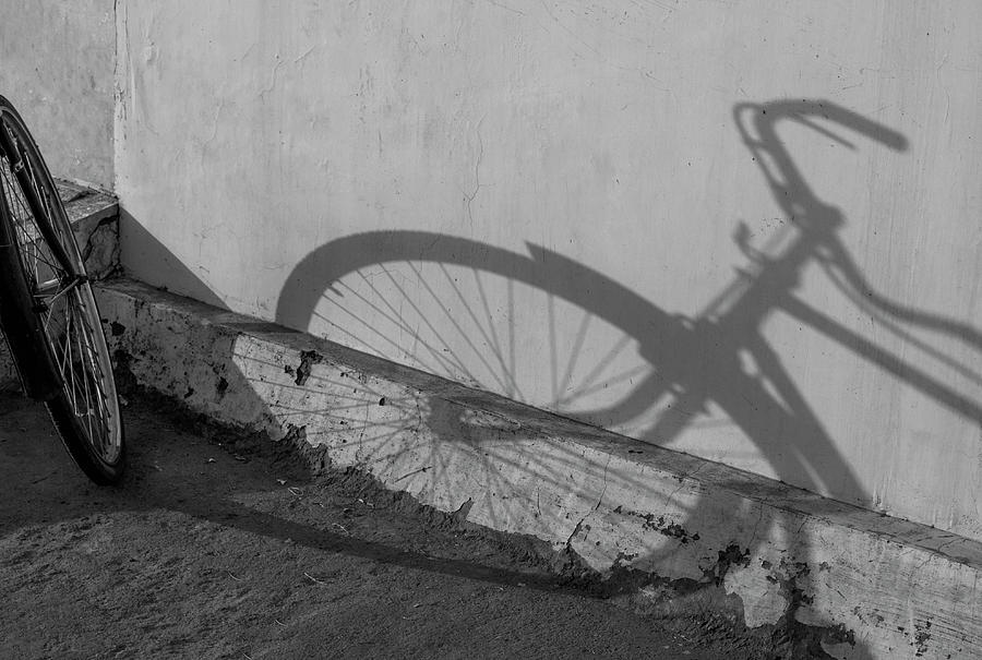 Long Shadow of Bicycle Photograph by Prakash Ghai