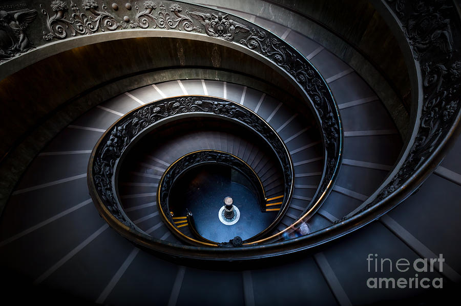Architecture Photograph - Long spiral, winding stairs by Michal Bednarek