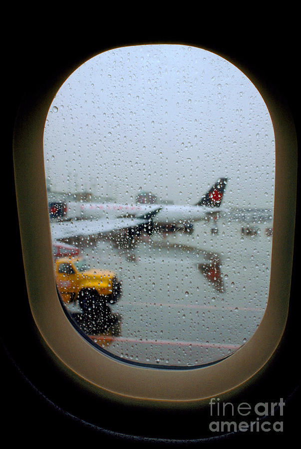 Looking Out an Airplane Window on a Rainy Day Photograph by Wernher Krutein