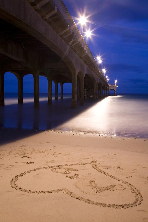 Love heart in the sand at Boscombe Pier Photograph by Ian Middleton