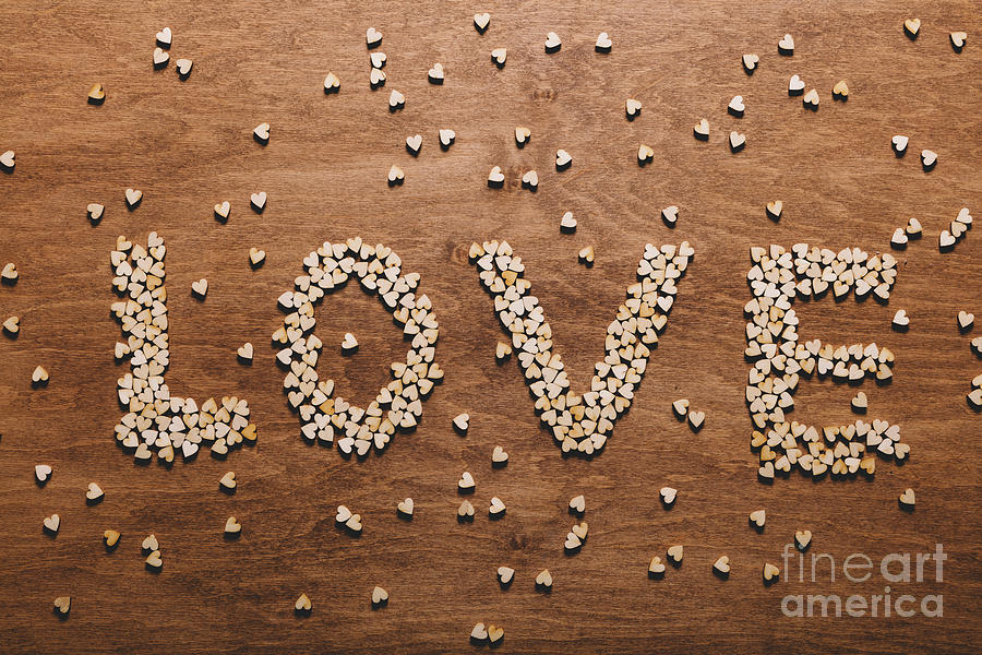 Love writing made out of little wooden hearts Photograph by Michal Bednarek
