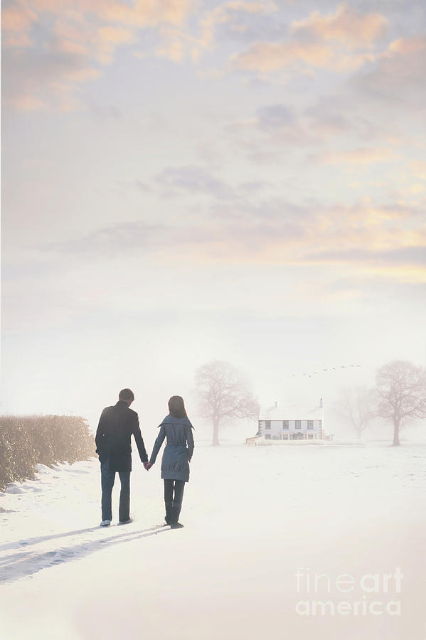Lovers Walking To A Cottage In Winter Snow Photograph by Lee Avison