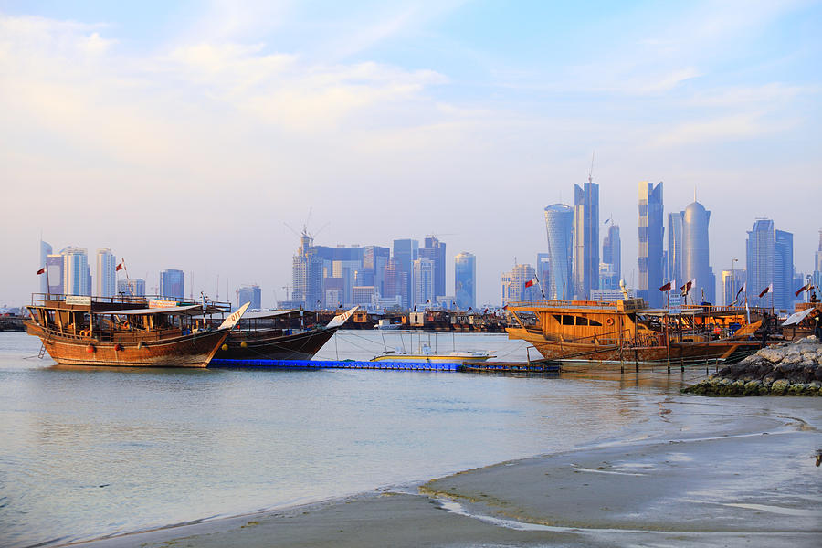 Low tide in Doha Harbour Photograph by Paul Cowan