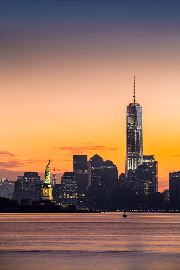 Lower Manhattan and the Statue of Liberty at sunrise Photograph by Mihai Andritoiu