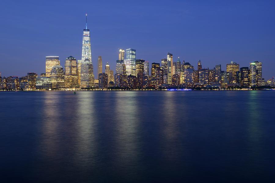 Lower Manhattan skyline at night with One World Trade Center Photograph by Merijn Van der Vliet
