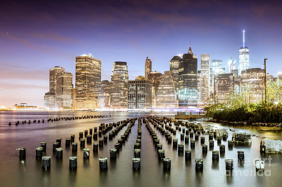 Lower Manhattan skyline reflected in the East river at dusk, New Photograph by Matteo Colombo