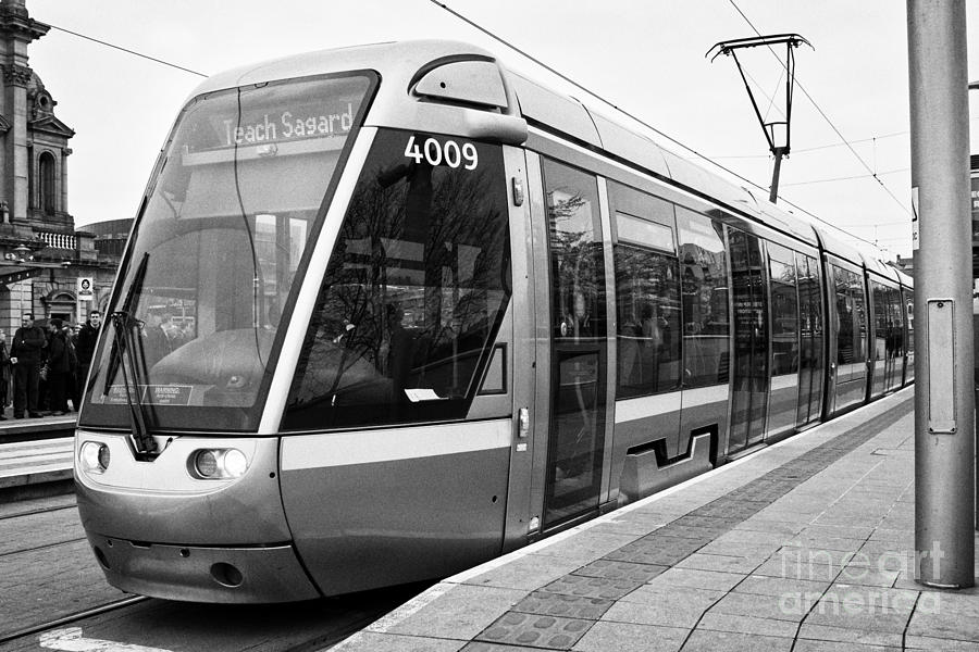 Transportation Photograph - luas tram at platform dublin Ireland by Joe Fox