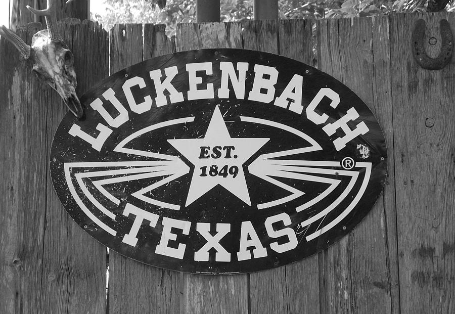 Black And White Photograph - Luckenbach Texas est. 1849 Sign by Elizabeth Sullivan