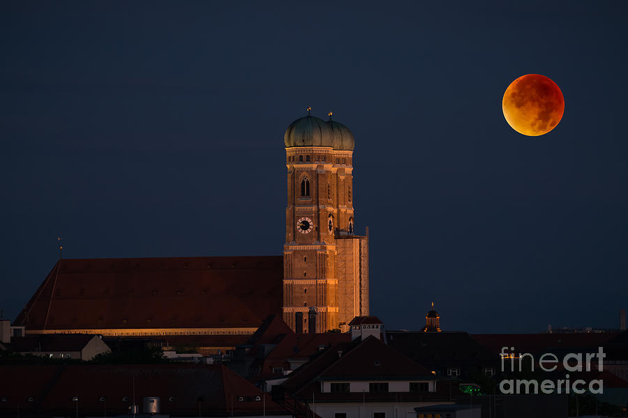 Lunare eclipse above Munich Photograph by Hannes Cmarits