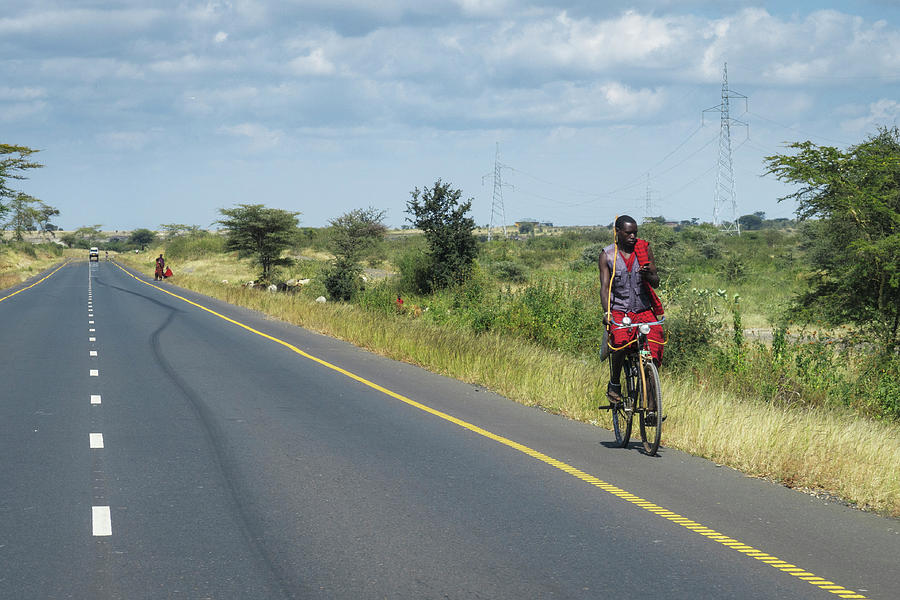 Maasai on Bike with Cell Phone Photograph by Mary Lee Dereske