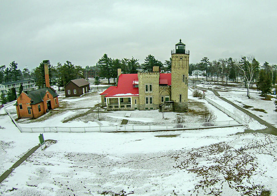 mackinaw city Light House Complex with snow Photograph by Alex Grichenko