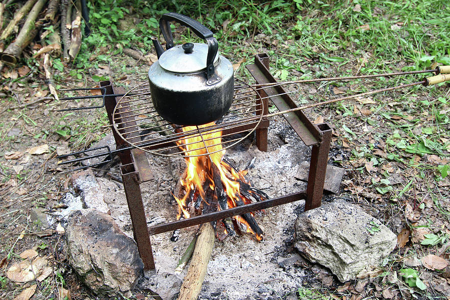 Making tea on the camp fire Photograph by Michal Boubin
