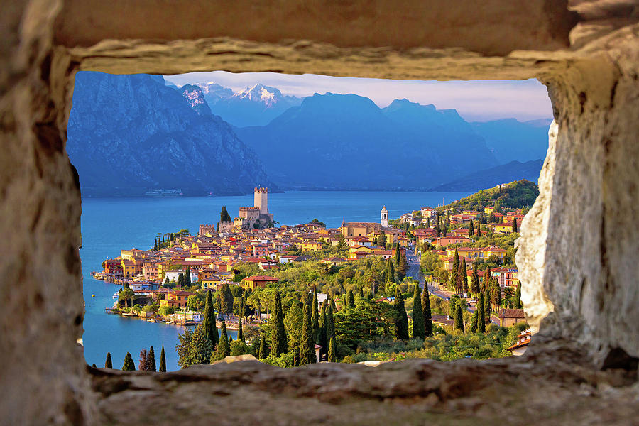 Malcesine and Lago di Garda aerial view through stone window Photograph by Brch Photography