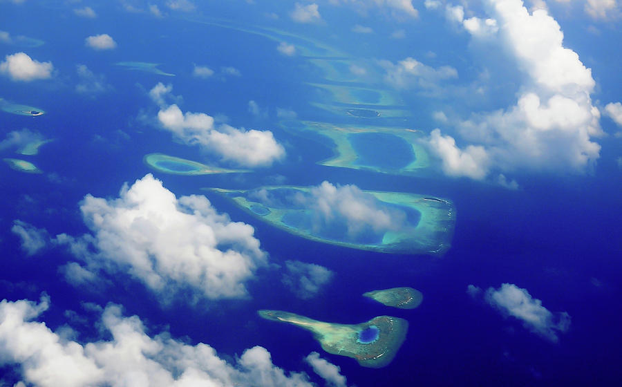 Maldivian Dreams. Aerial Journey Around Maldives Photograph by Jenny Rainbow