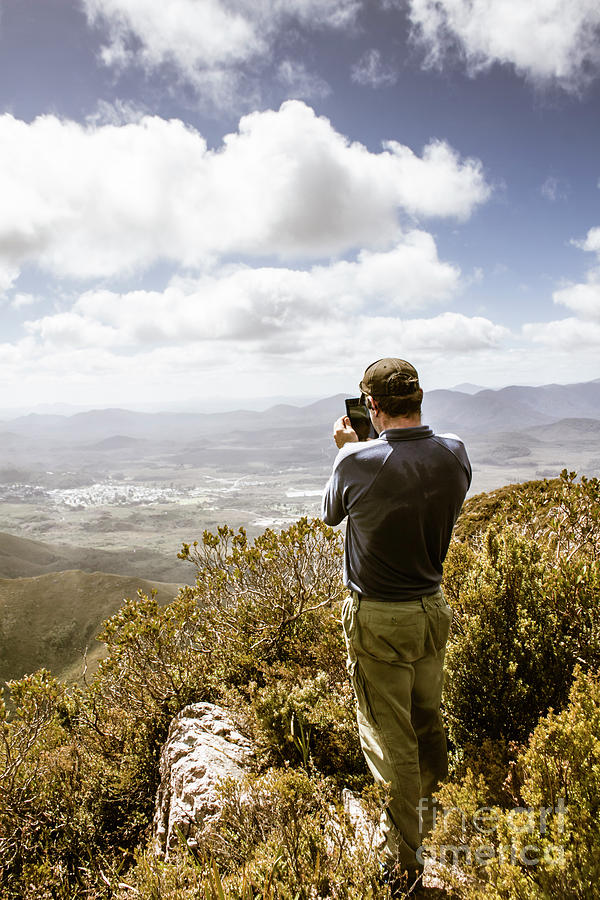 Nature Photograph - Male tourist taking photo on mountain top by Jorgo Photography
