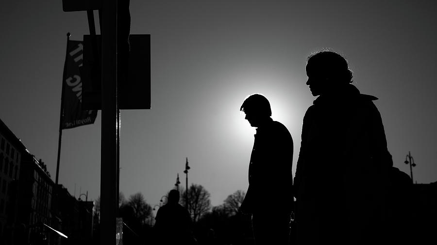 Man and woman in backlight - Helsinki, Finland - Black and white street photography Photograph by Giuseppe Milo