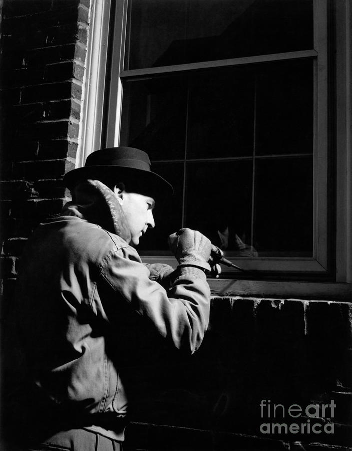 Man Breaking Into Building, C.1950s Photograph by H. Armstrong Roberts/ClassicStock