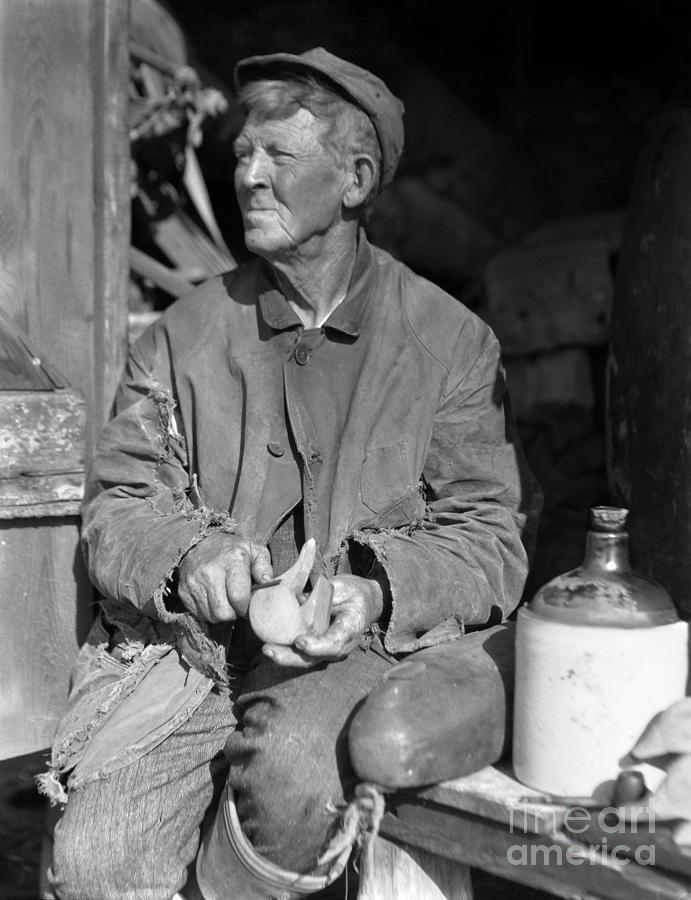Man Carving Duck Decoy, C.1920-30s Photograph by H. Armstrong Roberts/ClassicStock