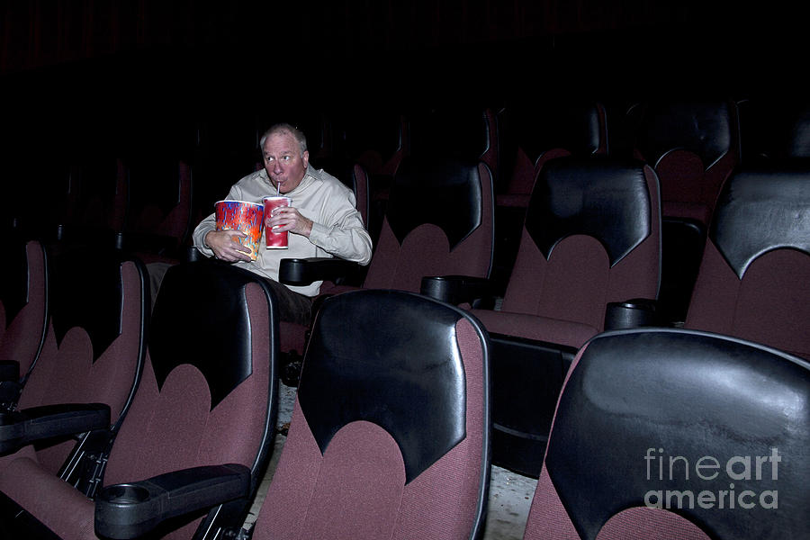 Man Enjoying Movie Concessions Photograph by Karen Foley