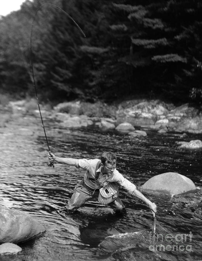 Fish Photograph - Man Fishing In Stream by H. Armstrong Roberts/ClassicStock