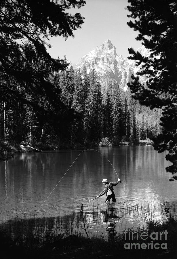 Man Fishing With Net And Rod Photograph by D. Corson/ClassicStock