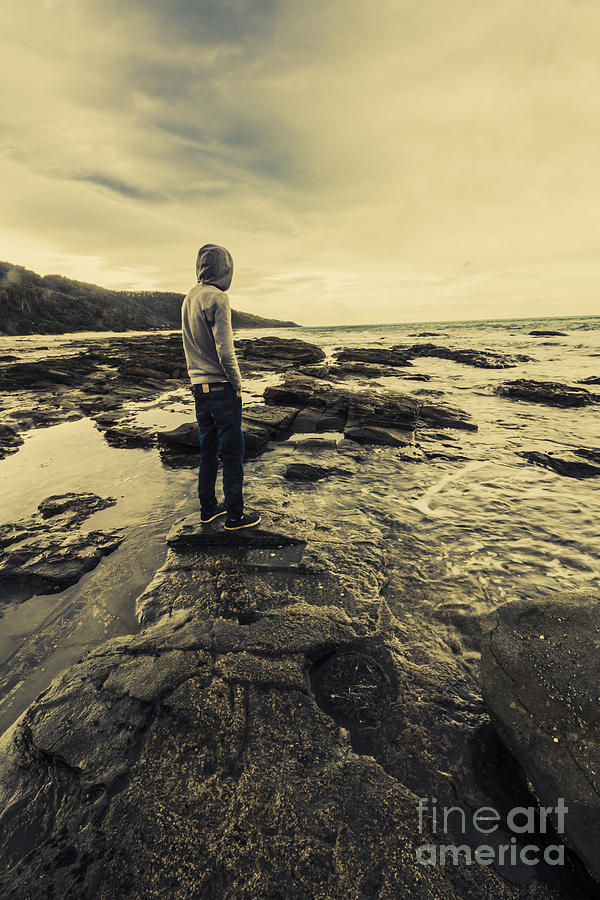Man gazing out on coastal rocks Photograph by Jorgo Photography