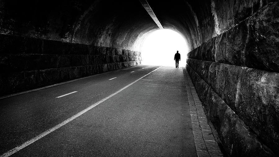 Man going out of a tunnel - Helsinki, Finland - Black and white street photography Photograph by Giuseppe Milo