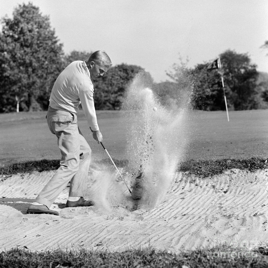 Man Golfing In Sand Trap, C.1960s Photograph by H. Armstrong Roberts/ClassicStock