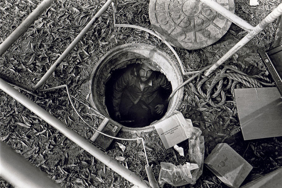 Manhole Photograph - Man in a Hole by Matt Plyler