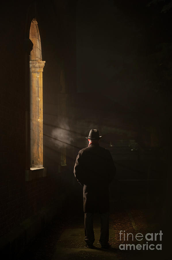 Man In An Overcoat And Fedora By A Window In Fog At Night Photograph by Lee Avison