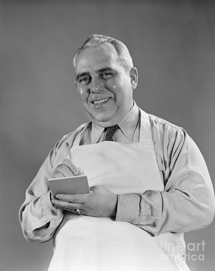 Man In Apron Taking Down An Order Photograph by H. Armstrong Roberts/ClassicStock