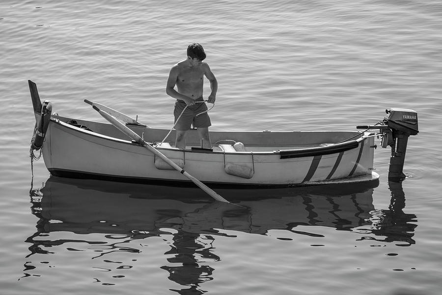 Man in Boat Italy Photograph by John McGraw