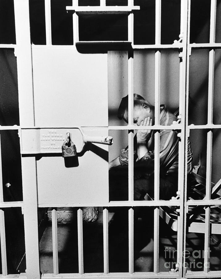 Man In Jail Cell, C.1960s Photograph by H. Armstrong Roberts/ClassicStock