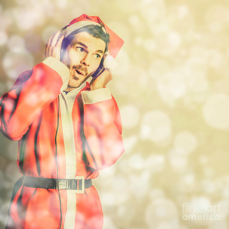 Man in santa costume listening to christmas songs Photograph by Jorgo Photography