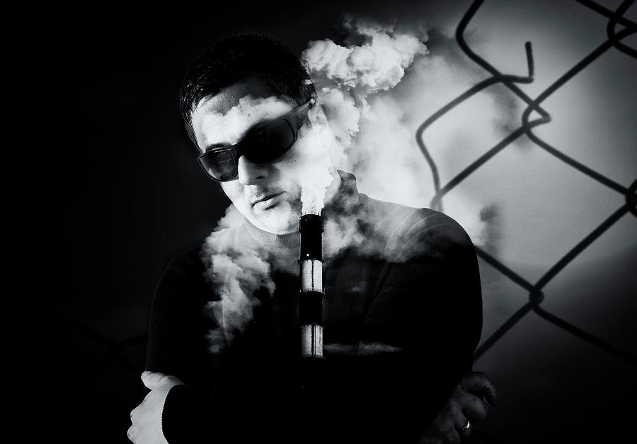 Man in Sunglasses and Industrial Chimney Stack Creative Image Photograph by John Williams