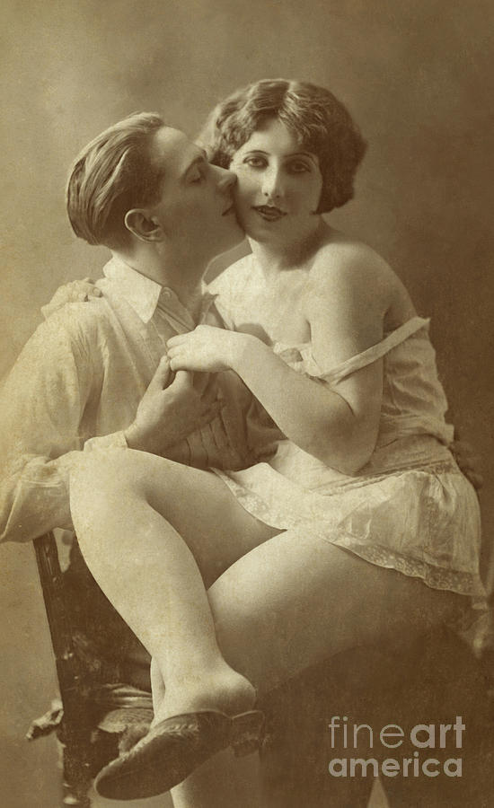 Man kissing woman on cheek  Photograph by English School