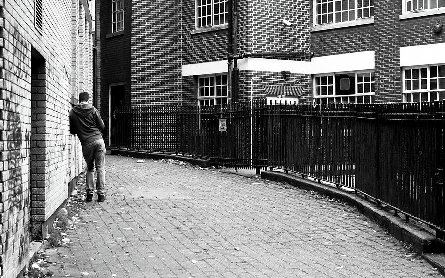 Man Leaning Against Brick Wall Photograph by Jacek Wojnarowski - Fine ...