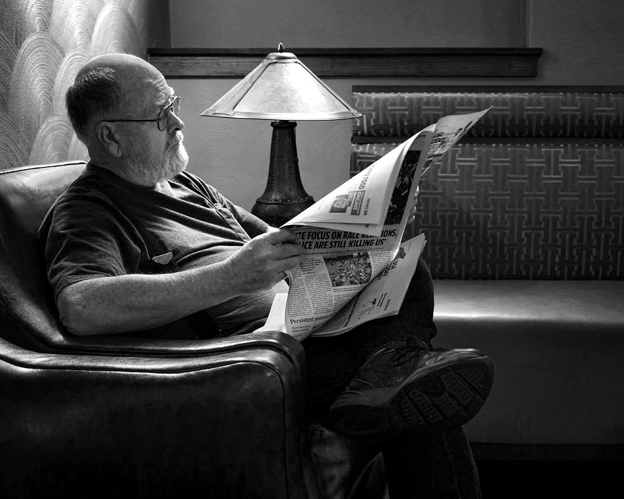 Black And White Photograph - Man - Reading - Newspaper by Nikolyn McDonald