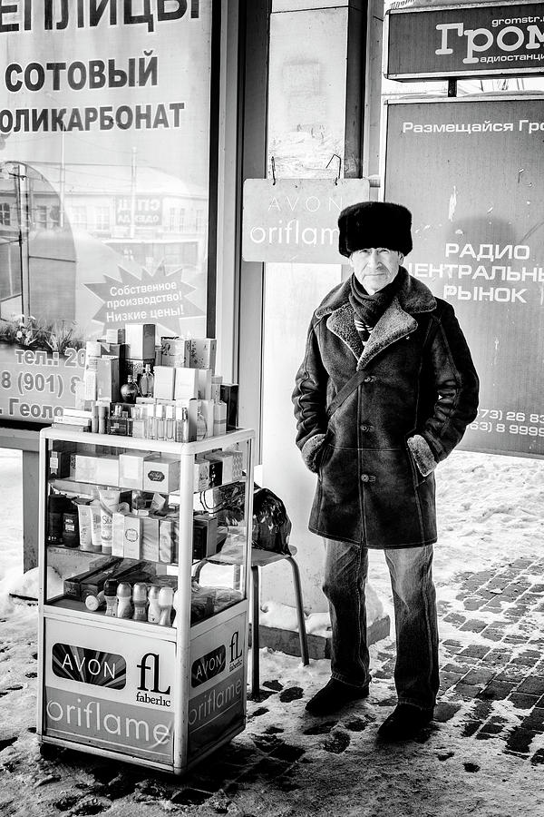 Man Selling Avon Perfume Photograph by John Williams