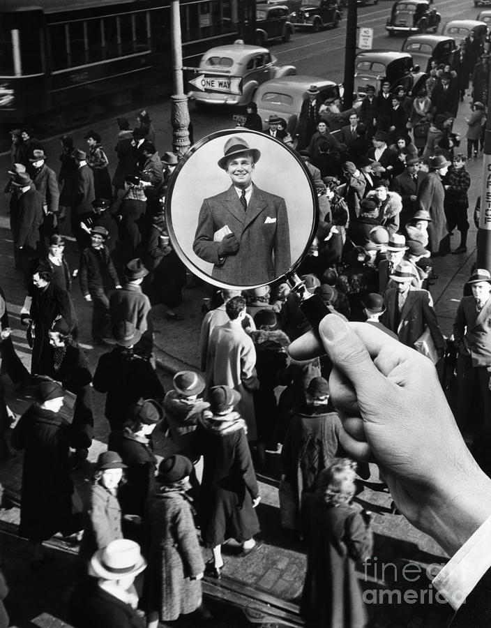 Man Singled Out With Magnifying Glass Photograph by H. Armstrong Roberts/ClassicStock