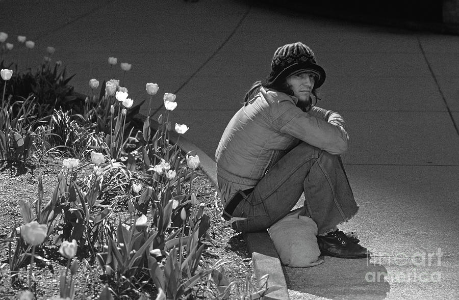 Man sitting along Curb  Photograph by Jim Corwin