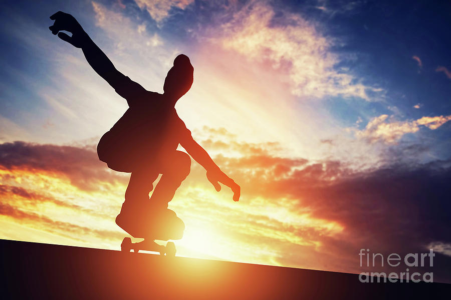 Man skateboarding at sunset. Photograph by Michal Bednarek