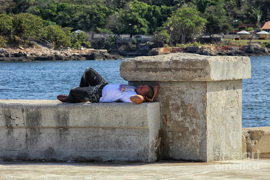 Man sleeping on a wall  Photograph by Patricia Hofmeester