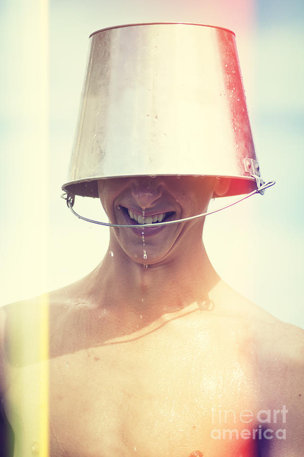 Man Wearing Water Bucket On Head In Summer Heat Photograph