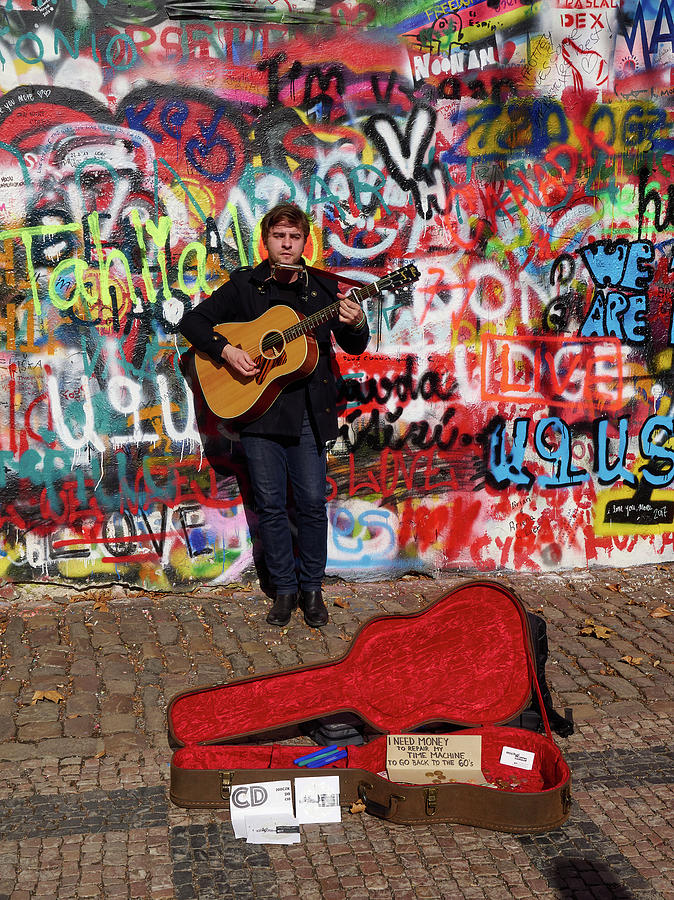 Man with a Guitar by The Lennon Wall. Chrispy Cheeks. Mala Stra Photograph by Jouko Lehto